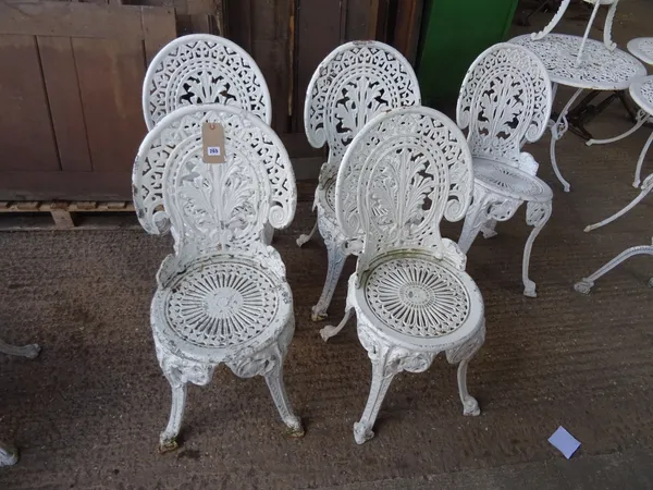 Garden furniture, comprising; a set of five 20th century white painted cast iron garden chairs, (5).   OUT
