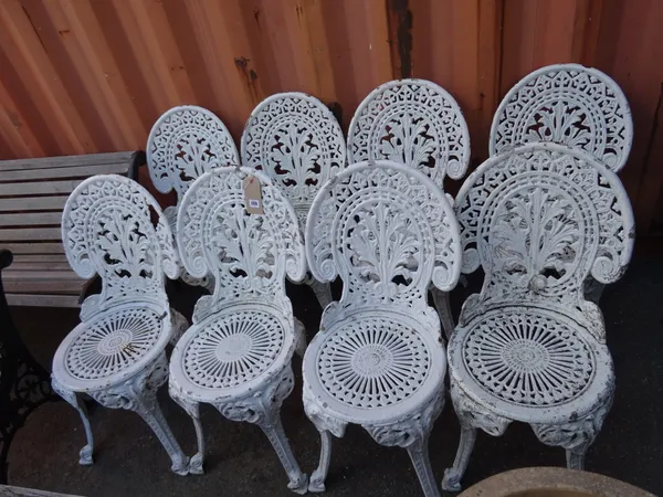 Garden furniture, comprising; a set of eight 20th century white painted cast iron garden chairs, (8).  OUT