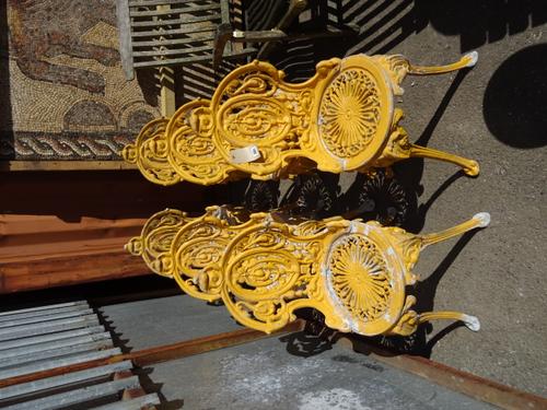 A set of six 20th century yellow painted cast metal garden chairs, (6).   OUT