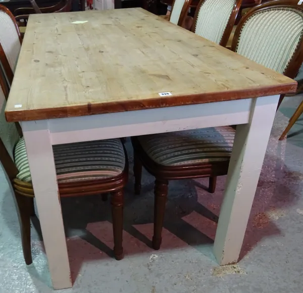 A 20th century rectangular pine kitchen table on white painted block supports, 178cm wide x 76cm high. C9