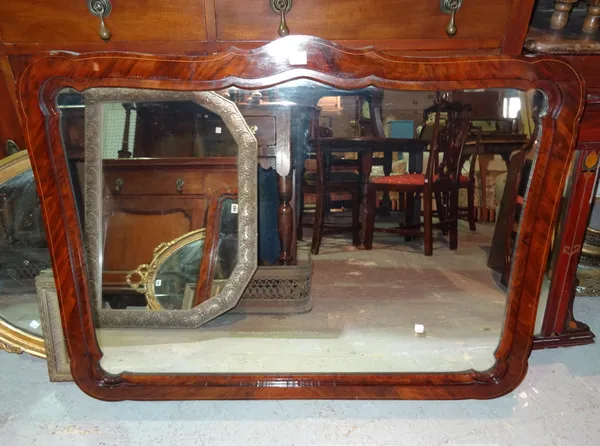 An Edwardian walnut framed rectangular wall mirror, 110cm wide x 80cm high and an Edwardian shield shaped wall mirror, 62cm wide x 80cm high, (2).  J1