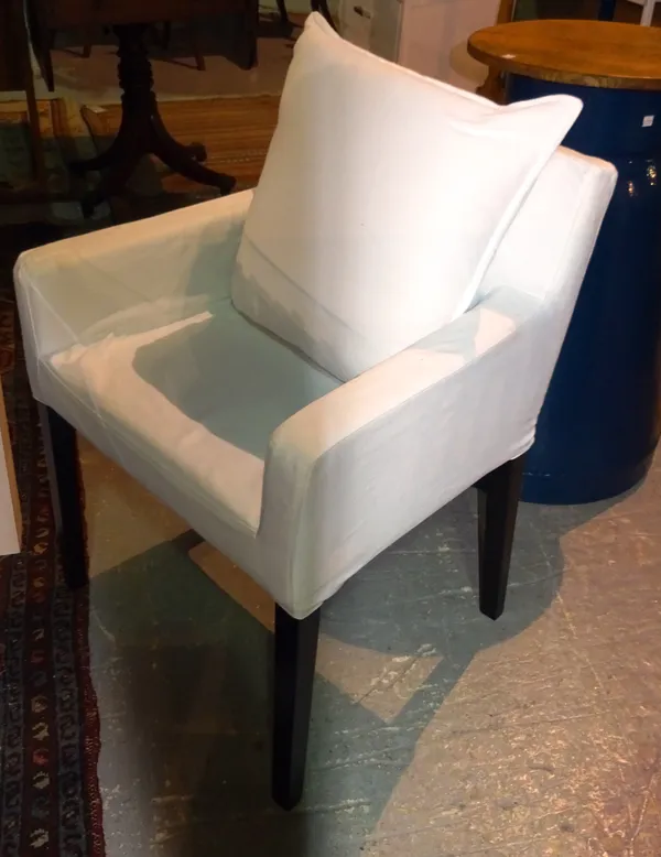 A set of four 20th century white upholstered chairs with ebonised supports, (4).   C8
