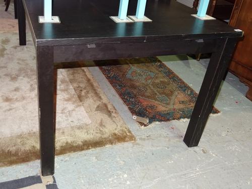 A 20th century black painted extending dining table with extra leaf, 175cm long x 215cm extended. D9