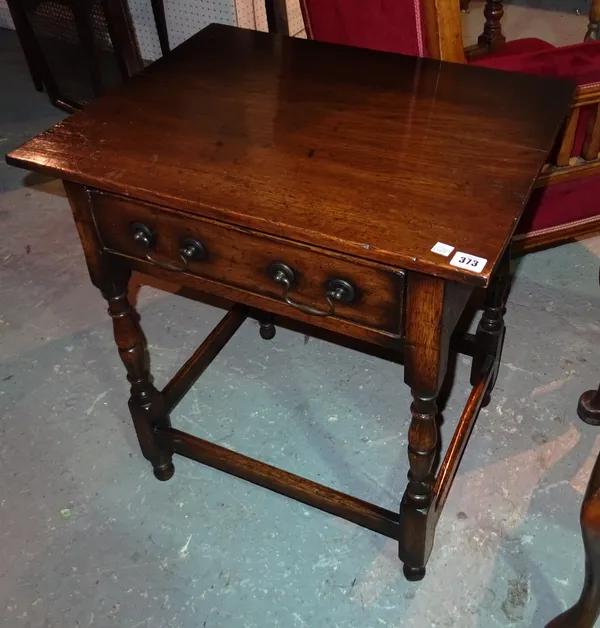 A 20th century oak single drawer side table with perimeter stretcher, 60cm wide.  A5