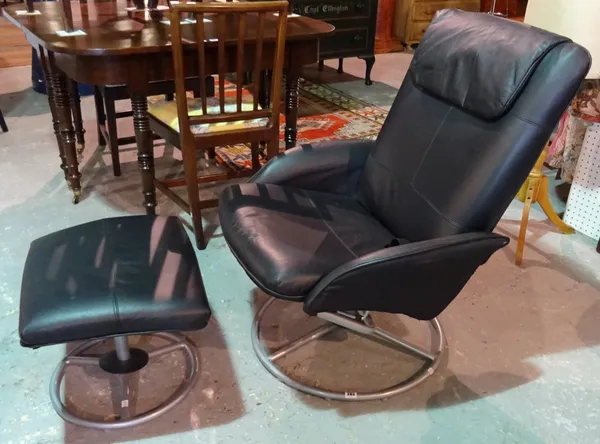 A 20th century faux leather reclining chair and metal stool, (2).  A7