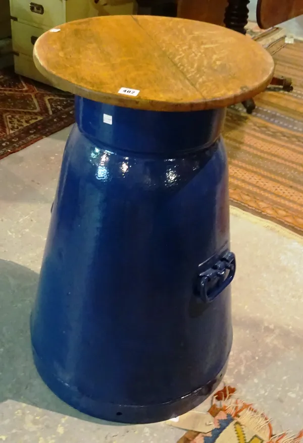 A large blue painted milk churn, possibly for railway use, with later wooden top, 81cm high.   F7