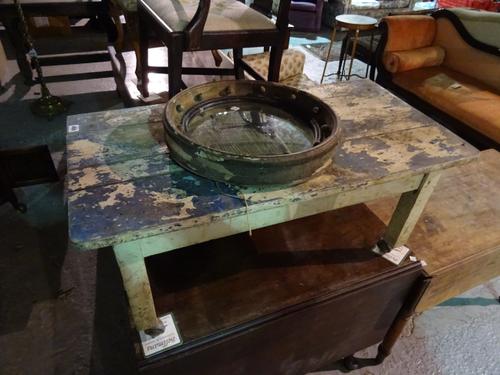 An early 20th century painted pine coffee table, 92cm wide x 41cm high, a Regency gilt framed convex mirror and a leather upholstered footstool, (3).