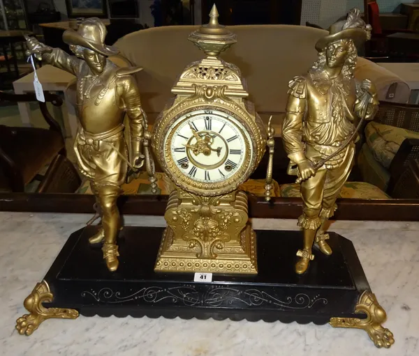 A 20th century spelter mantel clock flanked by two figures on black metal plinth base, 1 x key, 62cm wide x 53cm high.  F5