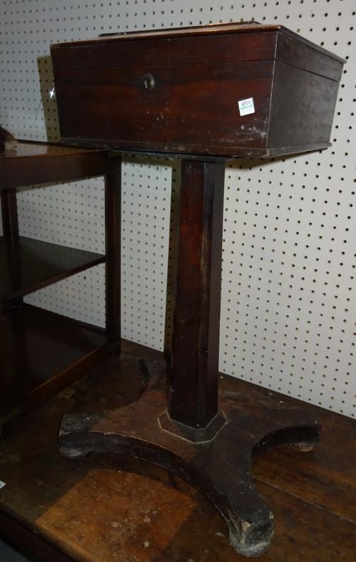 A Regency rosewood teapoy of sarcophagus form on quatrefoil base, 34cm wide x 74cm high.  J10