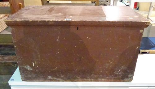 An early 20th century brown painted lift top trunk, 75cm wide x 41cm high.  J5