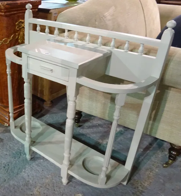 A 20th century white painted hall stand labelled Spillman & Co, on fluted turned supports, 84cm wide x 91cm high.  G4