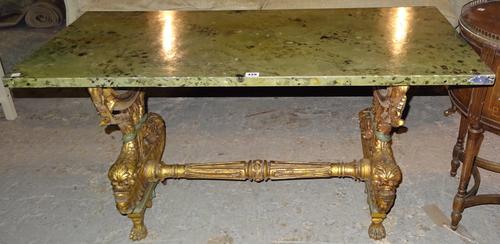 A 20th century giltwood coffee table, with faux green marble top on dolphin dual end supports, 115cm wide x 61cm high.  G4