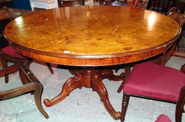 A Victorian style walnut inlaid circular dining table on four downswept supports, 150cm wide x 80cm high.  I6