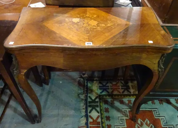 A 20th century kingwood marquetry inlaid gilt metal mounted foldover serpentine card table, on cabriole supports, 82cm wide x 80cm high.  G5