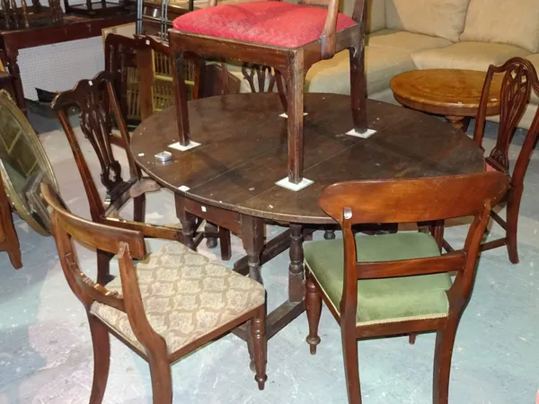 A matched set of four George III mahogany dining chairs and a pair of Victorian mahogany bar back dining chairs on tapering supports, (6).  J8