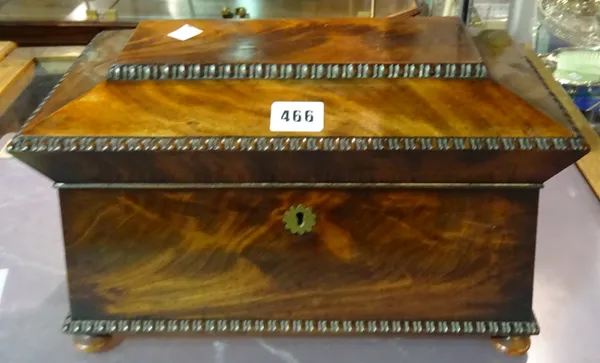 A George IV mahogany tea caddy of sarcophagus form, on bun feet, 34cm wide x 20cm high.  CAB