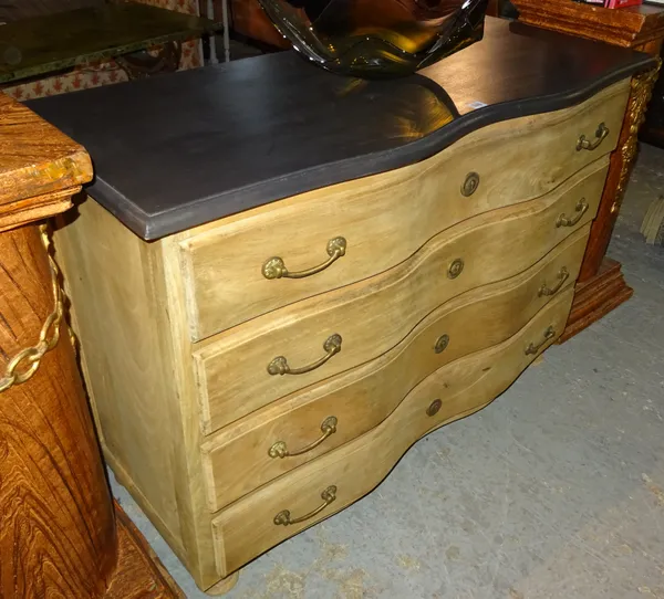 A 20th century French limed oak serpentine chest of four long drawers, 119cm wide x 84cm high.  F4
