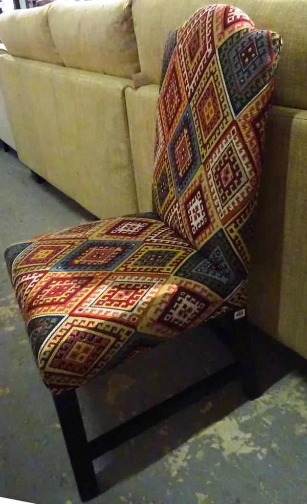 A 20th century upholstered high back dining chair on square block supports.  L9