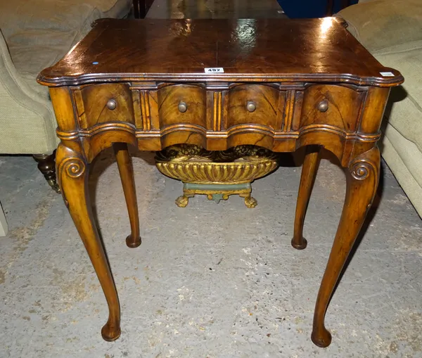 A Queen Anne style walnut side table on bun feet, 57cm wide x 74cm high.  G4