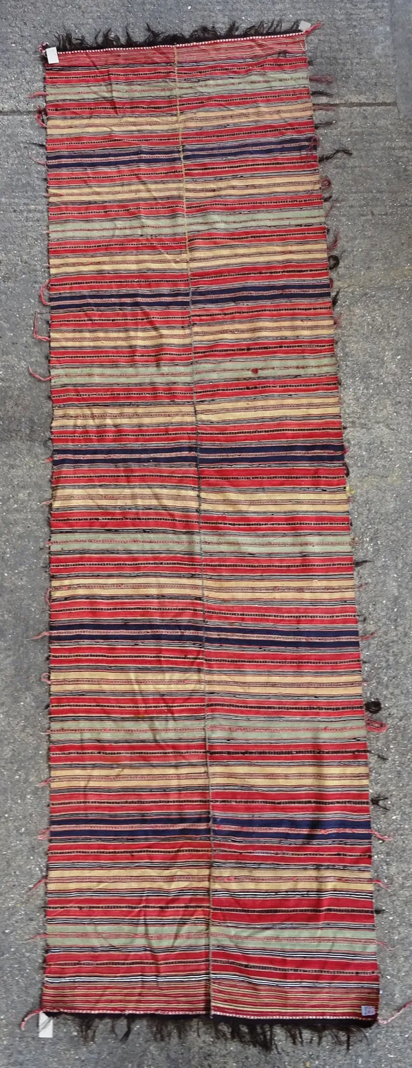 A Ghasghai flatweave rug, with a polychrome banded design, 470cm x 137cm.