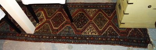 A Tabriz runner 276cm x 72cm.  BAY 2