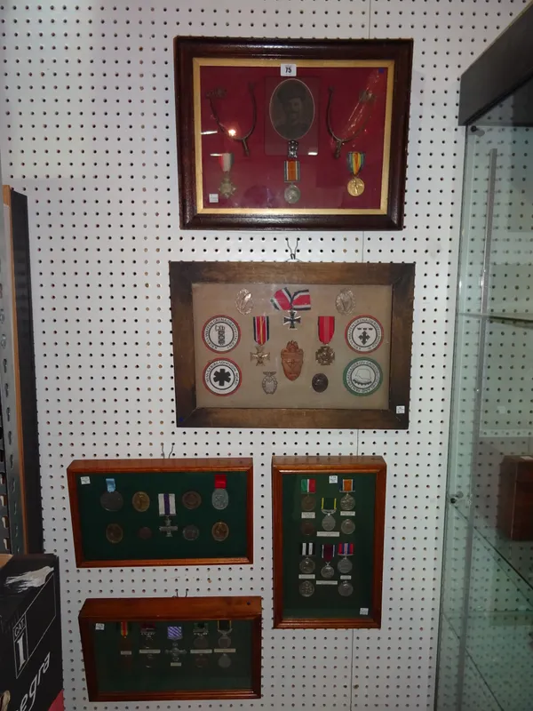 Military interest, comprising; five 20th century framed and glazed displays of restruck WWI & WWII medals.  B1