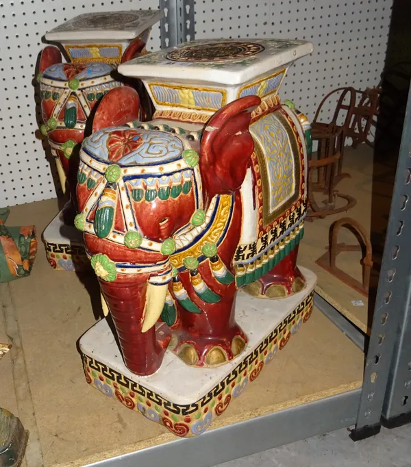 A pair of 20th century Asian ceramic garden seats formed as red elephants, 50cm high, (2).  S4B