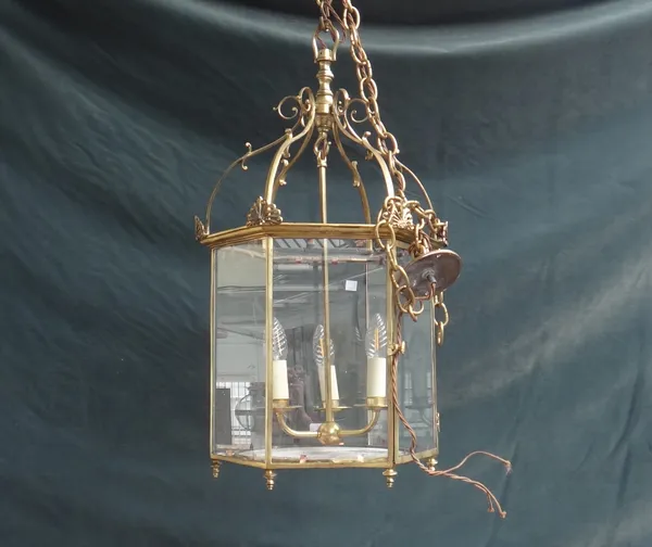 A Victorian style gilt metal lantern, late 20th century, of hexagonal form, with an internal three light fitment, 68cm high.