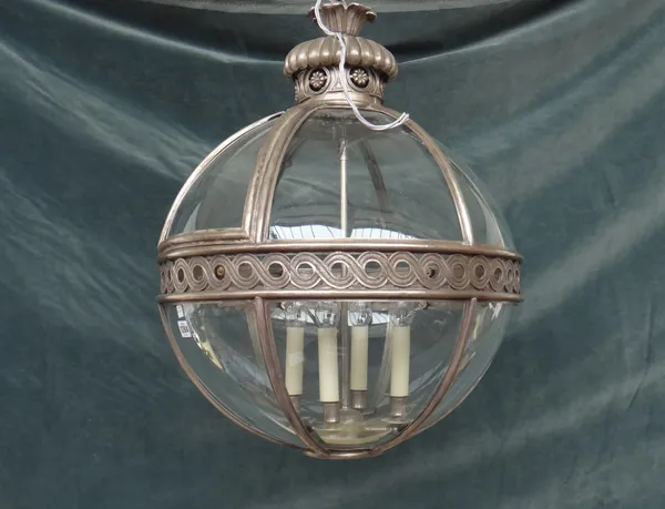 A modern silvered metal lantern, of globular sectional form, with a foliate pierced crown and internal four light fitment, 58 cm diameter.
