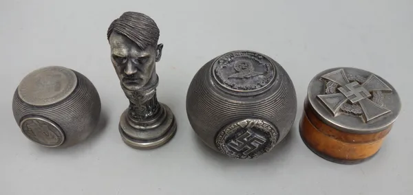 An Adolf Hitler NSDAP, Third Reich figural desk seal (7.5cm high), a NSDAP metal match striker of spherical form, with party stamp to the base, dated