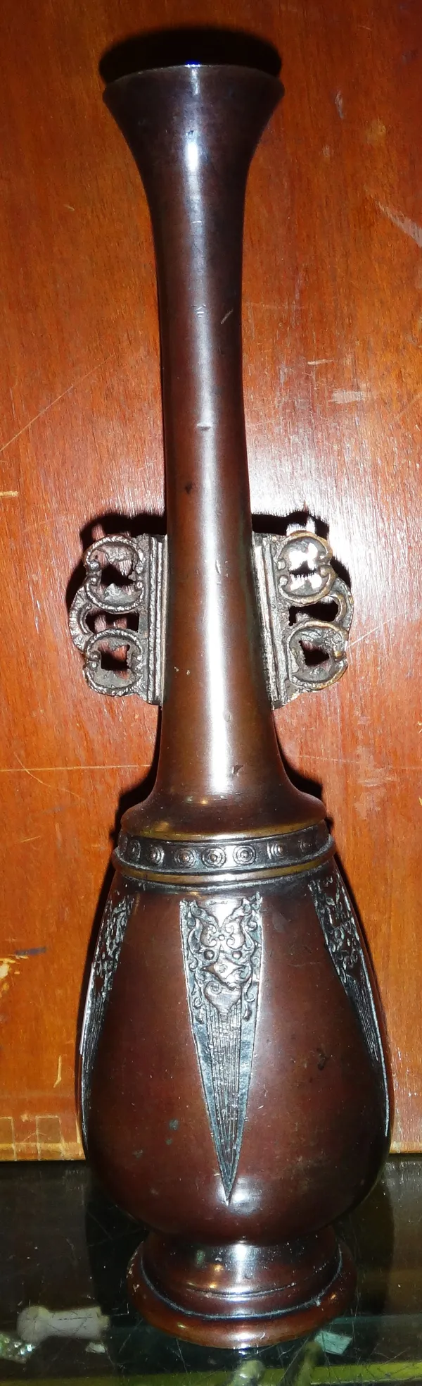 A pair of 20th century Asian bronze slender vases, (2).   CAB