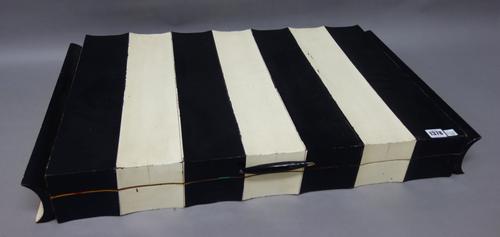 An Italian games compendium, mid-20th century, with a fitted interior containing various vintage games and counters, the case 77cm wide.