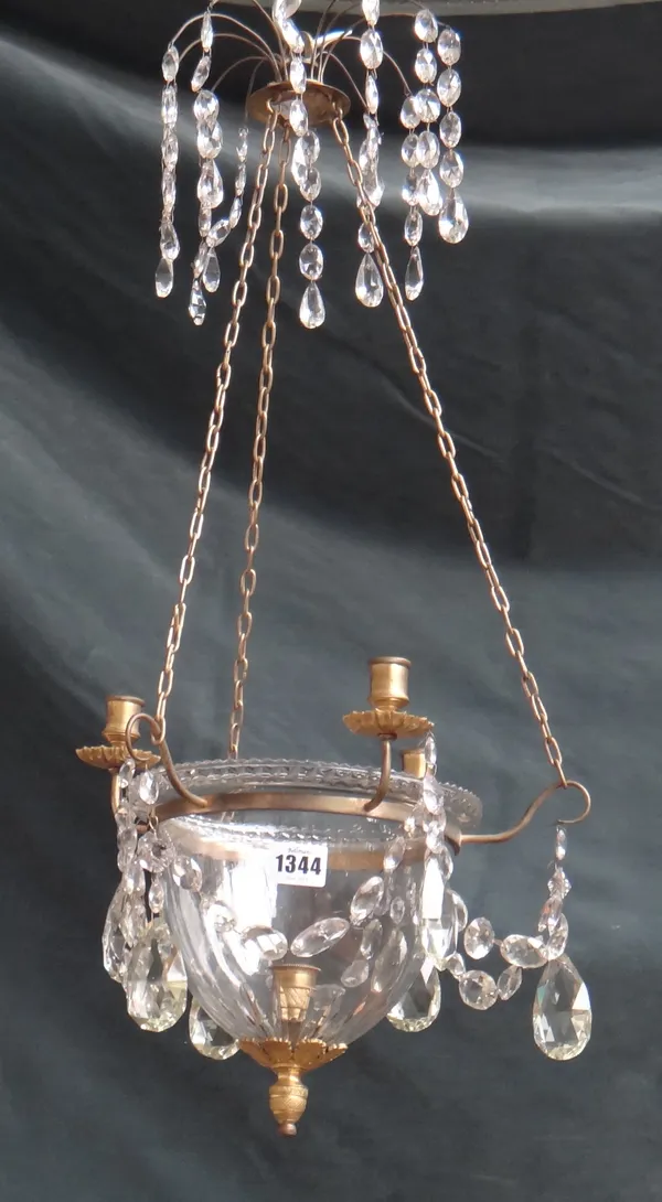 A George III style ormolu and glass chandelier, the bowl held by a gilt metal band with four candle sconces suspended by linked chains and decorated w