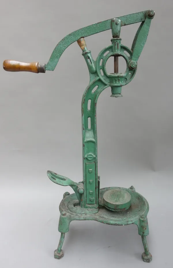 An early 20th century corking machine, green painted, with lever wooden handle and foot adjustment mechanism, (a.f), 80cm high.