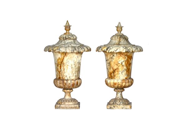 A pair of Italian grey veined white alabaster vase and covers, 19th century, of urn form, each on a square foot, 92cm high, (a.f), (2). Illustrated