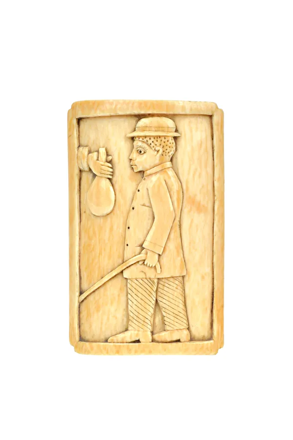 Tribal interest; an ivory paperweight, late 19th century, Loango coast, carved with a well-dressed African native against a rectangular ground, 10cm h