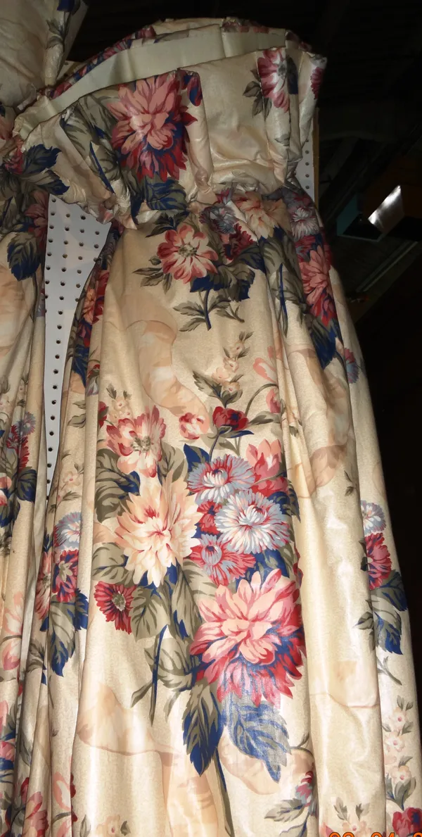 Curtains, comprising; a pair of cream ground, blue and pink floral curtains, lined and interlined, each 310cm wide x 210cm fall.  M9