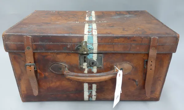 An early 20th century leather travel case by 'Drew & Sons, Piccadilly Circus, London', with brass hardware, leather straps and old travel labels to th