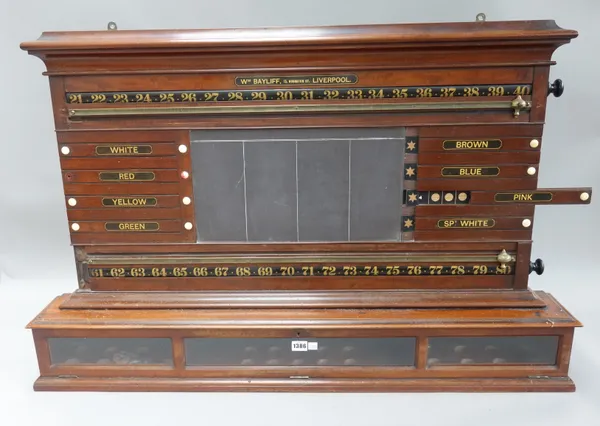 A mahogany snooker score board, by William Bayliff, 15 Houghton St, Liverpool, with central blackboard, cylinder revolving scores and glazed ball aper