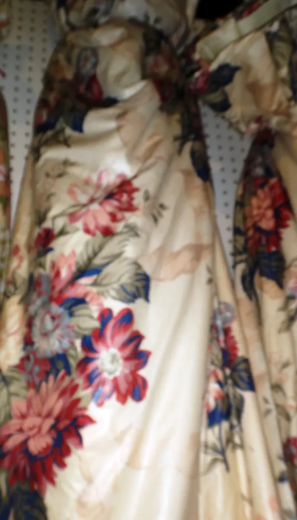 Curtains, comprising; a pair of cream ground, blue and pink floral curtains, lined and interlined, each 180cm wide x 210cm fall.  M9
