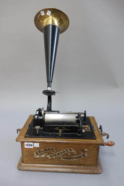 An Edison standard phonograph, with later horn and approximately seventy phonograph cylinders in two purpose made numbered cases. (a.f.)