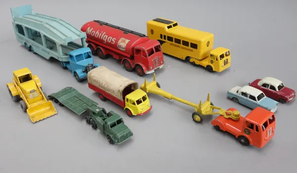 A quantity of die-cast vehicles, including; a Dinky 698 tank transporter, a Dinky 982 Pullmore car transporter, a Dinky 'Mobilegas' Foden, a Budgie 'J