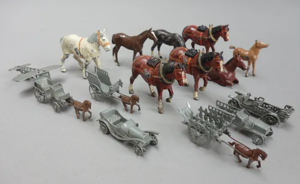 A quantity of Britains hollow cast lead farmyard animals and related accessories, together with a quantity of small die-cast vehicles, (qty).
