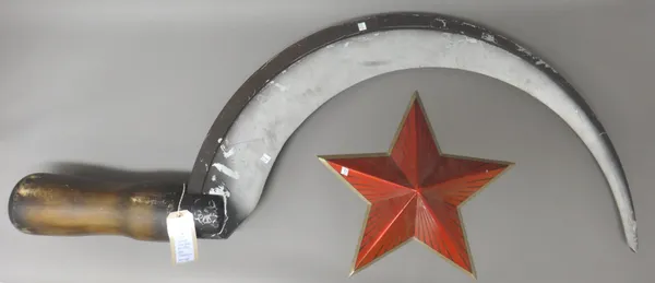 Film Props - The Sickle and Star props, as used in the film GoldenEye, 1995, featuring in the opening title sequence, the sickle approx. 135cm. high.