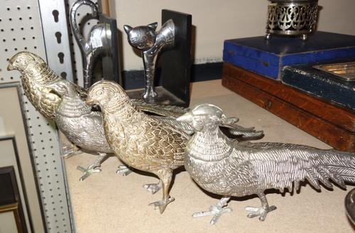 Silver plated wares, including; two pairs of models of pheasants, a trophy cup, flatware, wire work baskets and sundry, (qty).   S1M