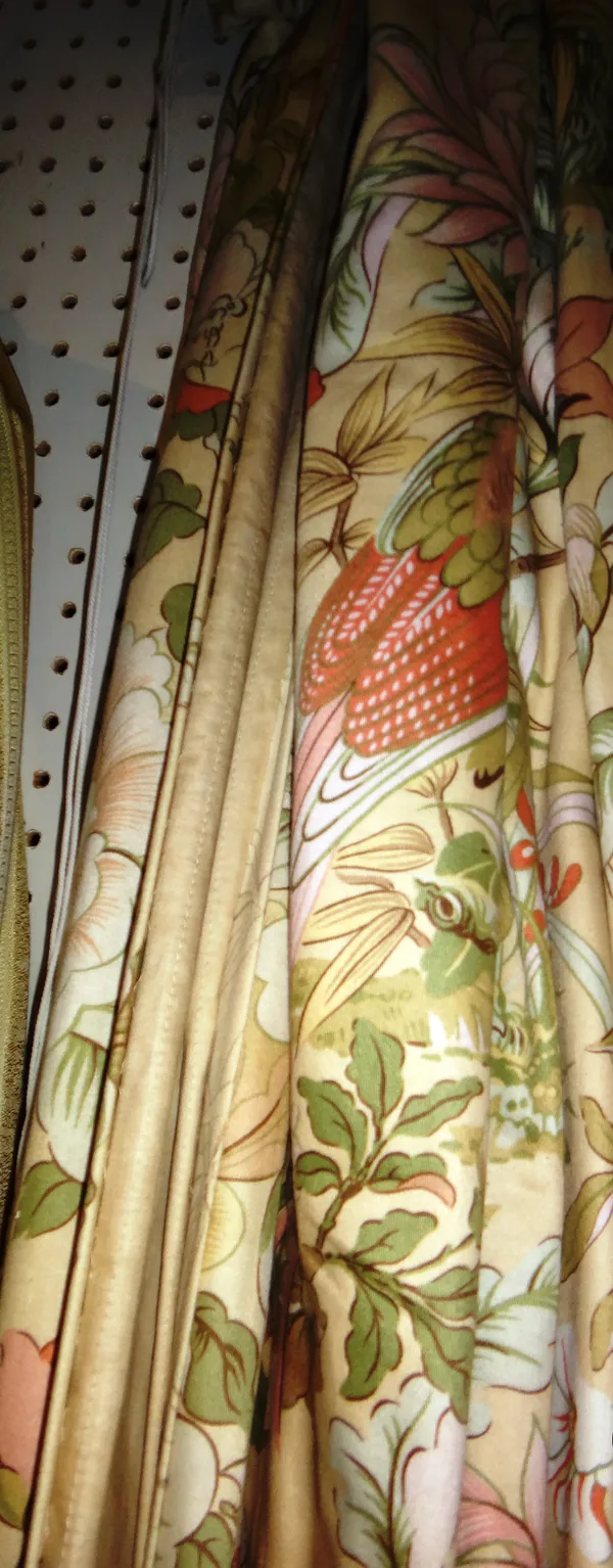 Curtains, comprising; a pair of cream ground,  pink and green flowers and birds, lined, each 140cm wide x 205cm fall.   M9