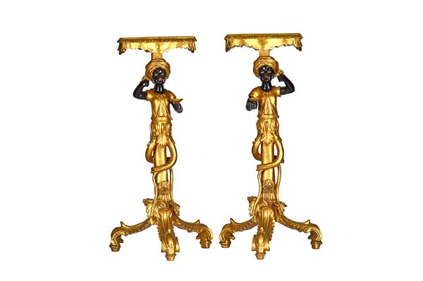 A pair of 20th century Blackamoor figural torchères, on scroll bases, 94cm high (2). Illustrated