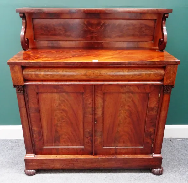 A William IV mahogany chiffonier, with ledge back over cushion drawer and pair of cupboards, on melon carved feet, 108cm wide 122cm high x 44cm deep.