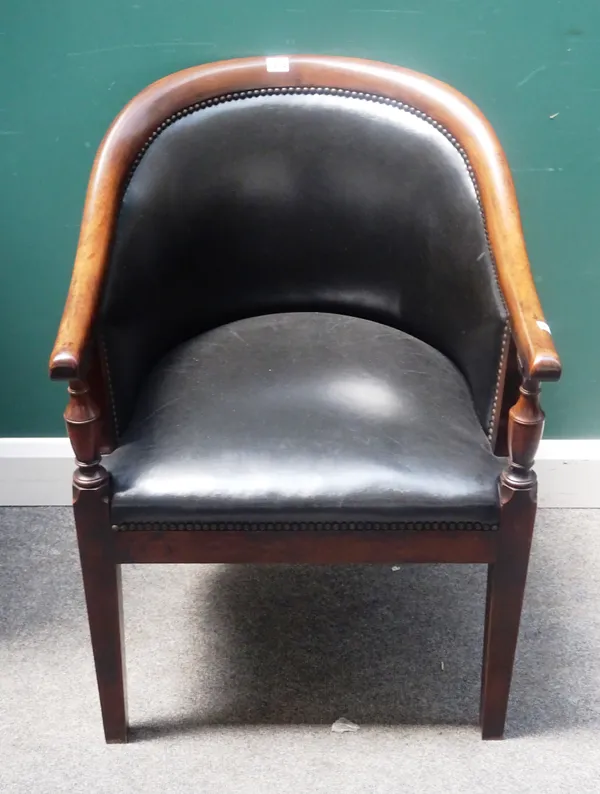 An early 19th century style tub back office chair, with studded green leather upholstery, on tapering square supports, 60cm wide x 86cm high.