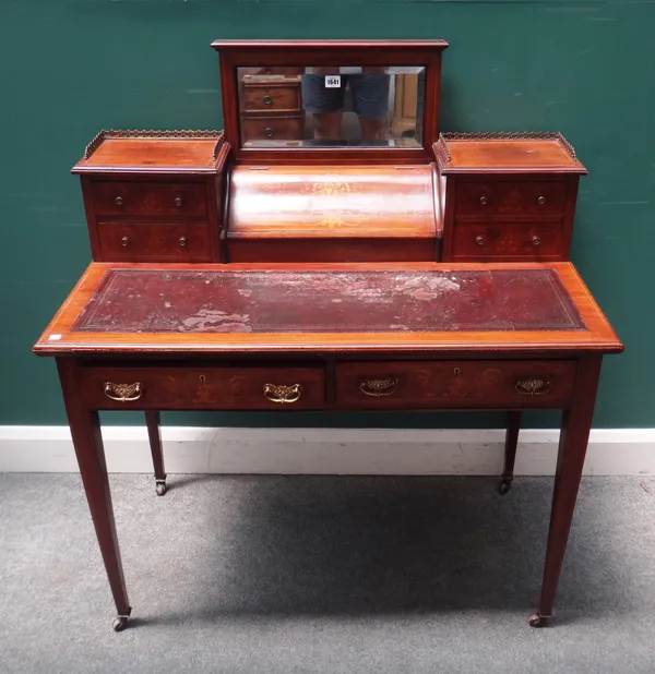 A late 19th century marquetry inlaid mahogany writing desk, with mirrored back fitted superstructure over a pair of frieze drawers, on tapering square
